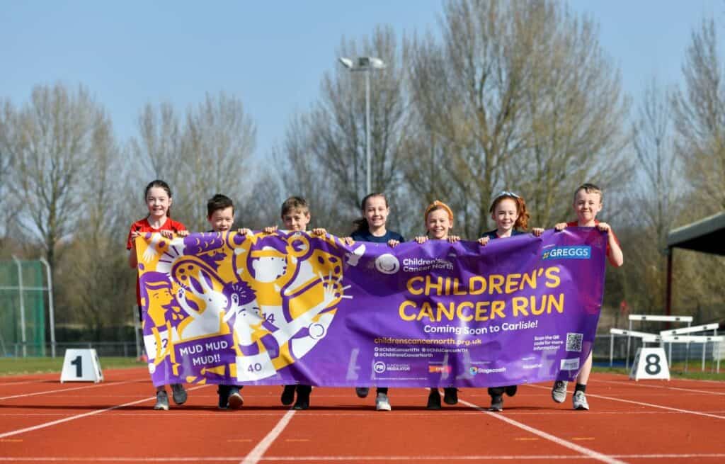 Mia Presch and Holly Brough (third and fourth from right with children from Inglewood Junior School