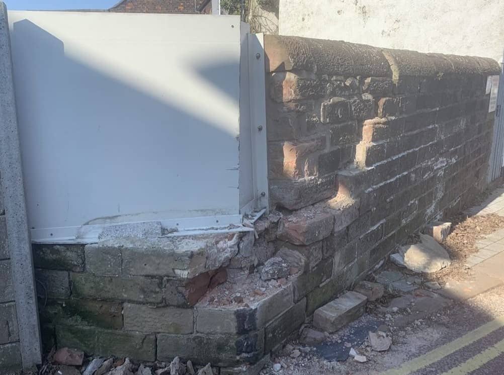 The dislodged wall above the railway track in Carlisle