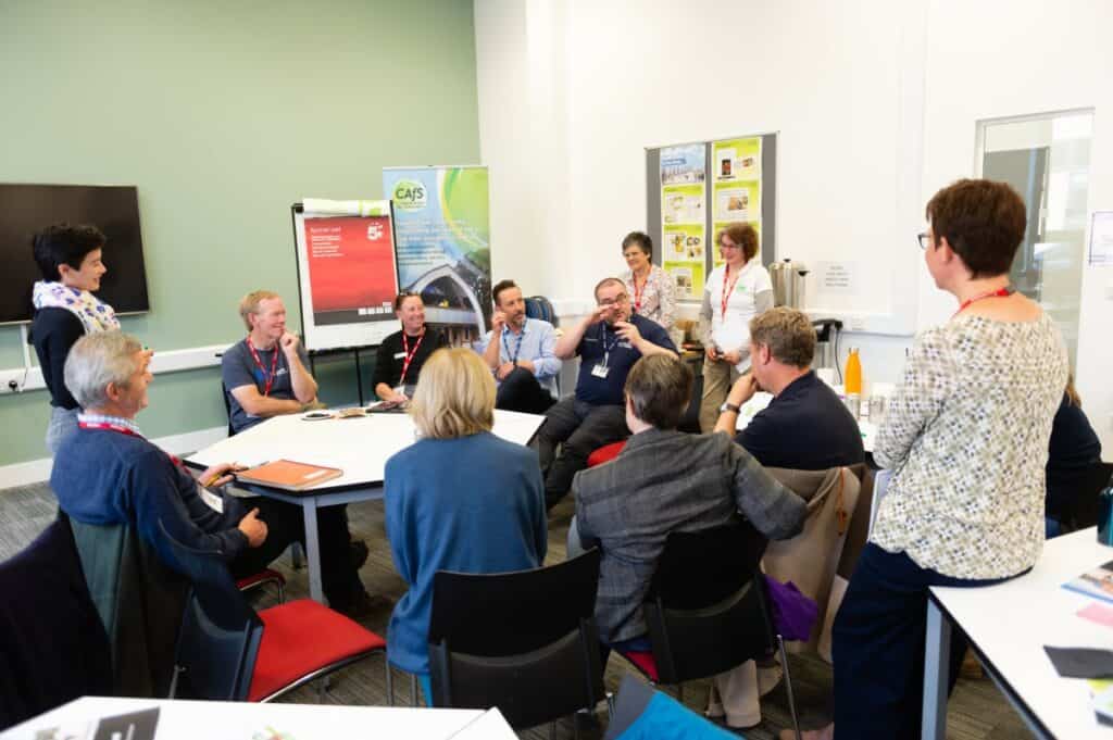 A carbon literacy course underway with  instructors hearing the ideas of attendees