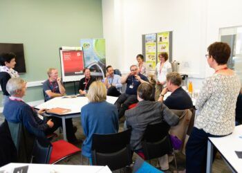 A carbon literacy course underway with instructors hearing the ideas of attendees