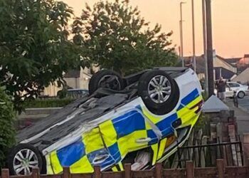 Police car flips upside down after crashing into Workington garden