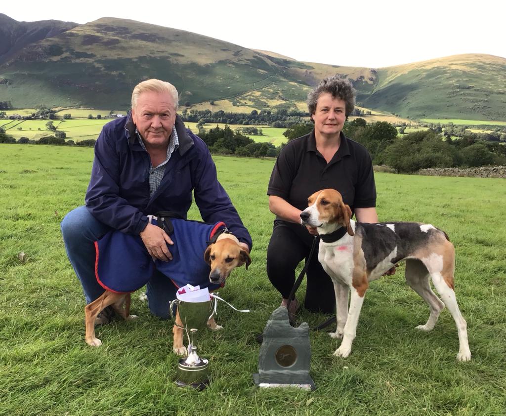 Puppy winner Graeme Little with Huntsman's Rebel and Dennis Bland with Huntsman's Nimrod who won the Open Banned.