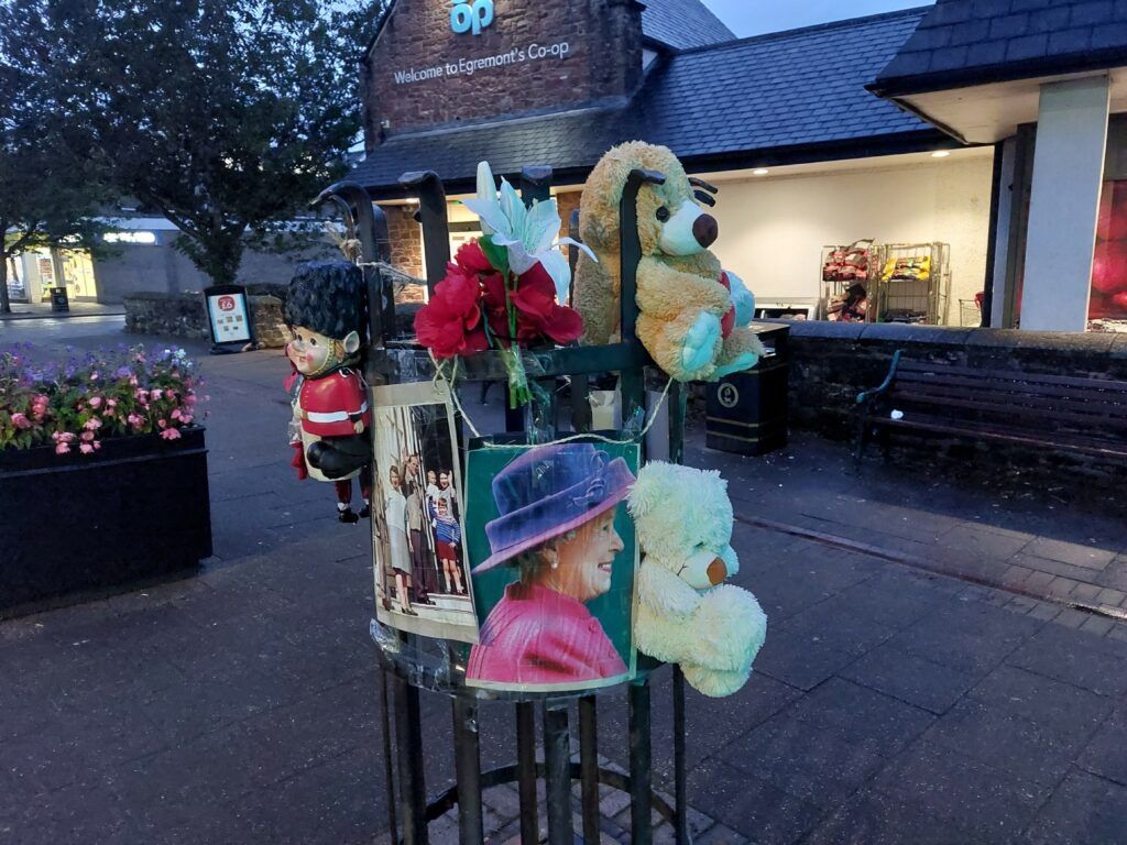 Toys and mementoes left on Egremont main street this evening. 
