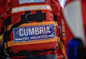 Cumbria Fire and Rescue service jacket, close up on the reflective and name label.